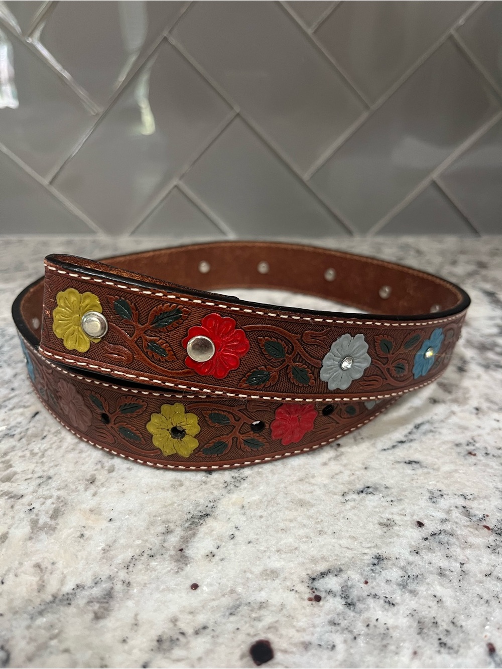 Nocona genuine leather tooled belt size 24- measures 28 3/4”